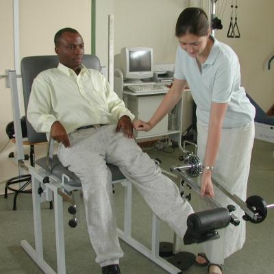 A female intern increasing her work experience and giving physiotherapy to a local man during her physiotherapy internship in Ghana. Female intern from Projects Abroad giving phsyiotherapy to a local man during her physiotherapy work experience in Ghana.